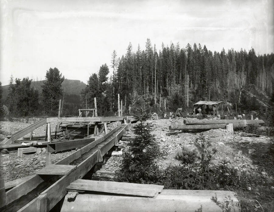 Men mining at the mouth of Fancy Gulch, which is located on the north side of the Coeur d'Alene Mining District.