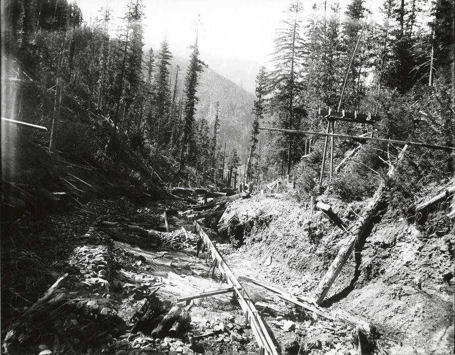 North side, Coeur d'Alene Mining District (Murray area).  Flumes allow the use of gravity to pull the water along the path and slow down naturally, deposting heavier minerals and metals along the way.