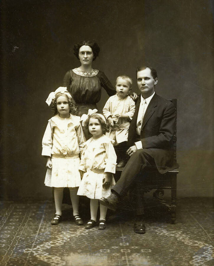Mr. and Mrs. Barnhardt posed with their two daughters and one son.