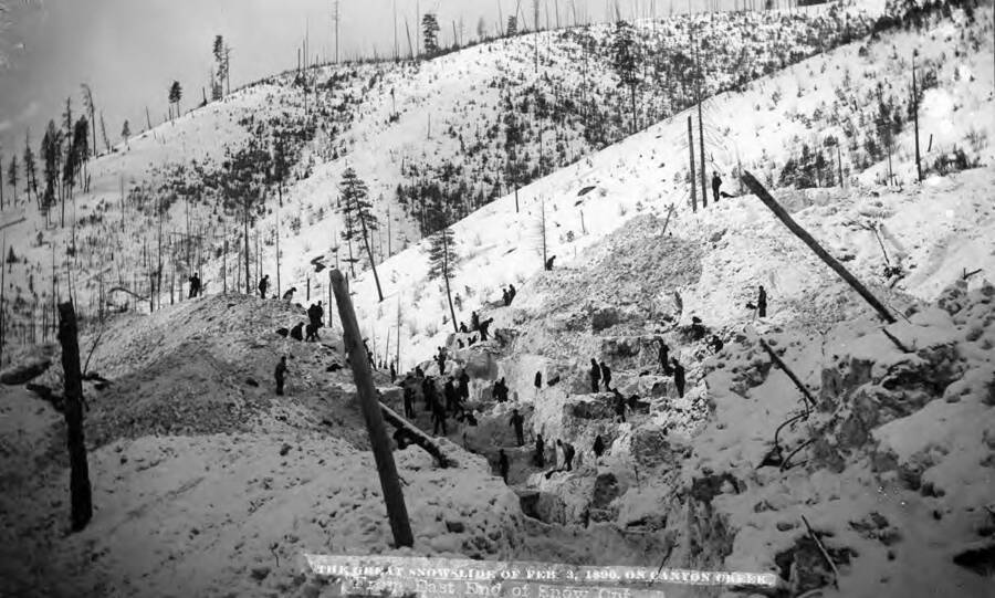 Shoveling Snow during the Great Snowslide of Feb. 3, 1890, on Canyon Creek, Idaho. View from east end of snow cut.