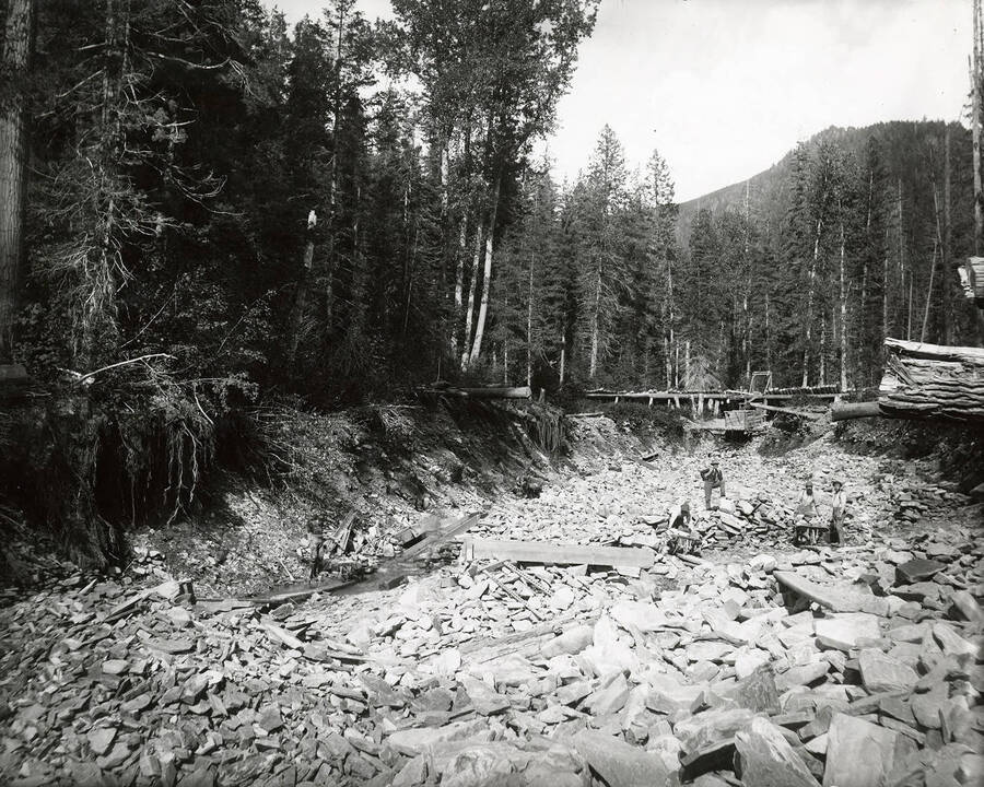 Men working at the Dunlap and Smith Placer at East Eagle Creek, which is located on the north side of the Coeur d'Alene Mining District.