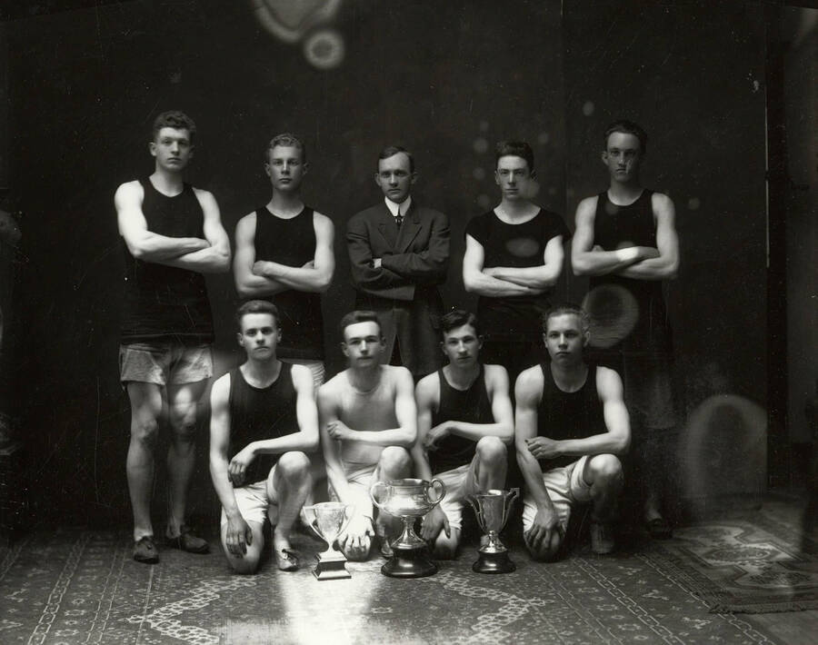 Group photo of the Wallace High School Boys' Track team. The seven of the team members were Ernest Murphy, Nathan Barnard, Will Barnard, Wesley Miller, Nicholson, Brass and Evans.