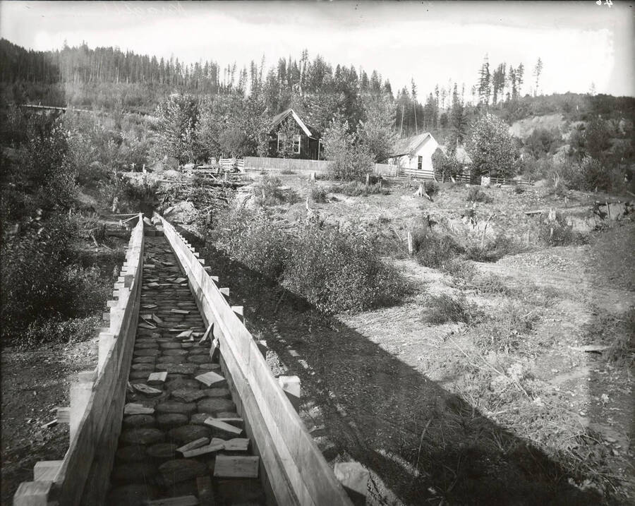 North side, Coeur d'Alene Mining District (Murray area). This flume carried water to the processing area from the original river source