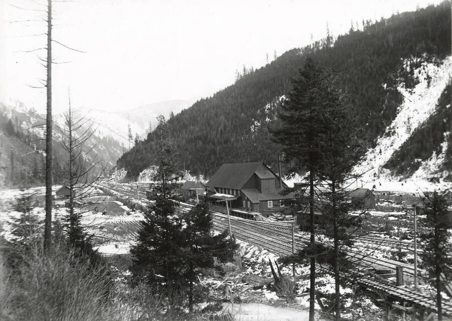 A distant view of the train station and sampling works in Wallace, Idaho.