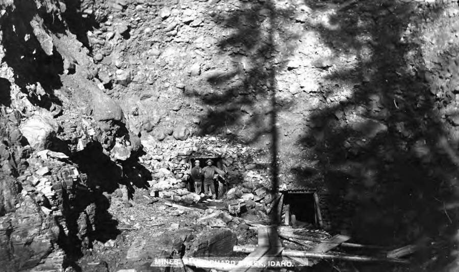 Image shows miners standing at the entrance of a mine near Prichard Creek, Idaho in 1890.