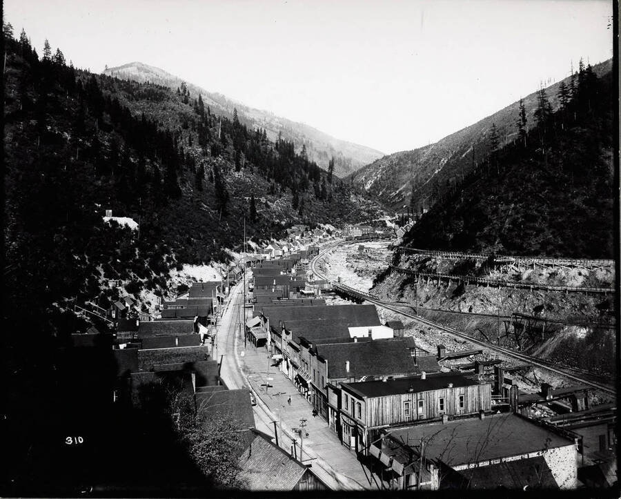 Far view of a mine town curving along next to the river