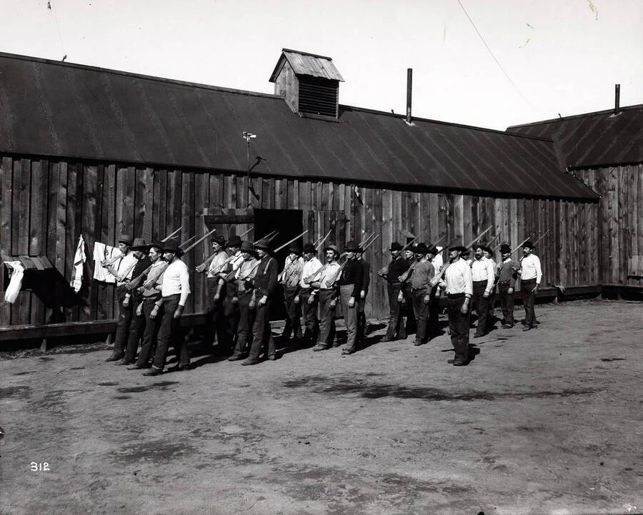 Men drilling with wooden guns