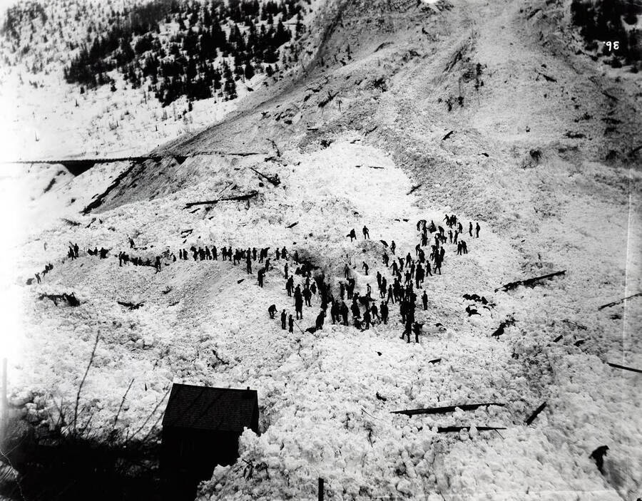 Image shows people gathered on the remains of a snow slide on March 29 in  Black Bear, Idaho [1894].
