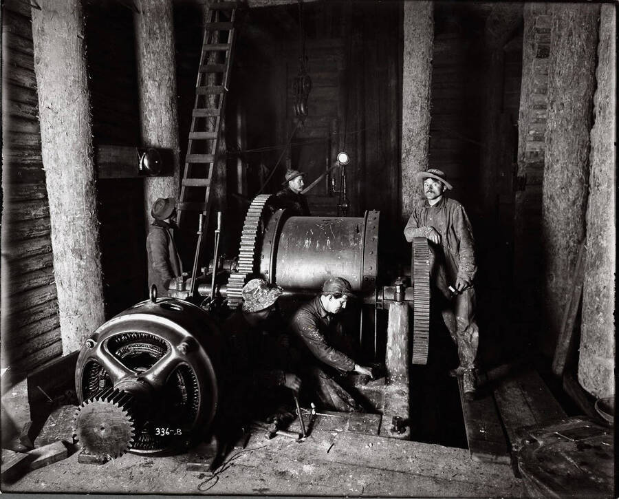 Interior showing men and machinery