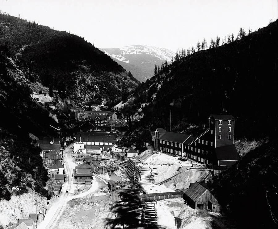 A distant view of the town Burke, Idaho, pictured in the foreground is Hecla Mine about 1900.