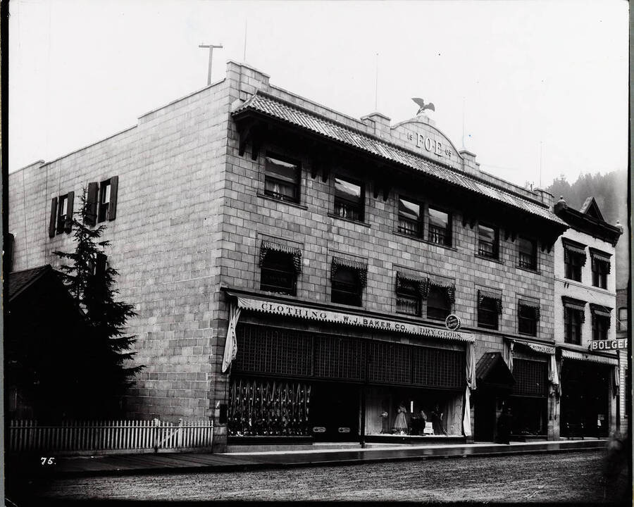 Exterior view of the Eagles block  in April 1908, also shows Wallace Supply Co., W.J. Baker Co., and other offices in Wallace, Idaho.