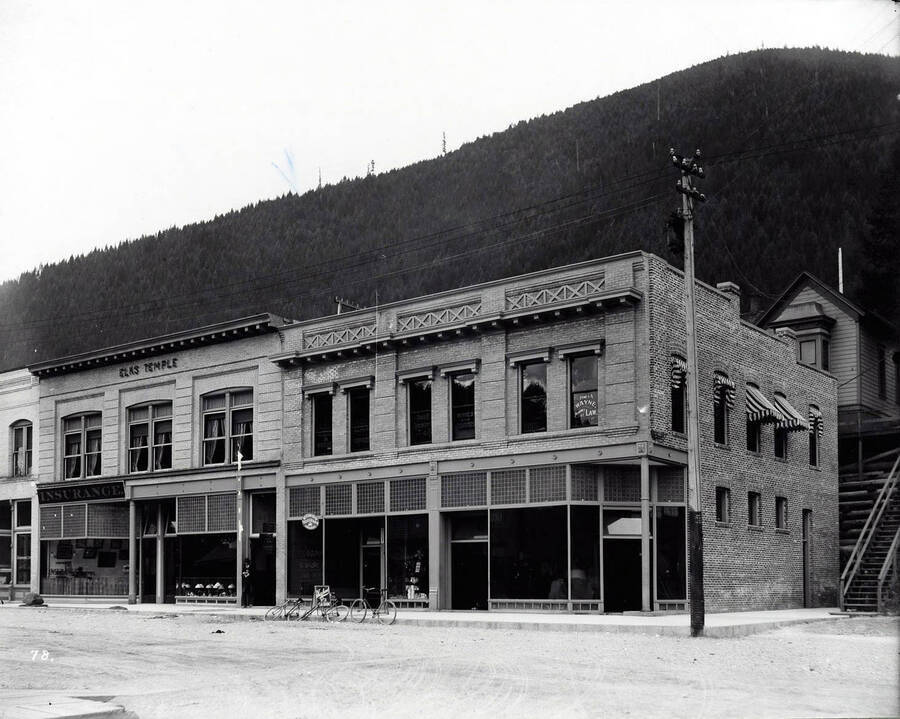 Exterior view of the Elks block shows Post office, Western Union office and others in Wallace, Idaho.