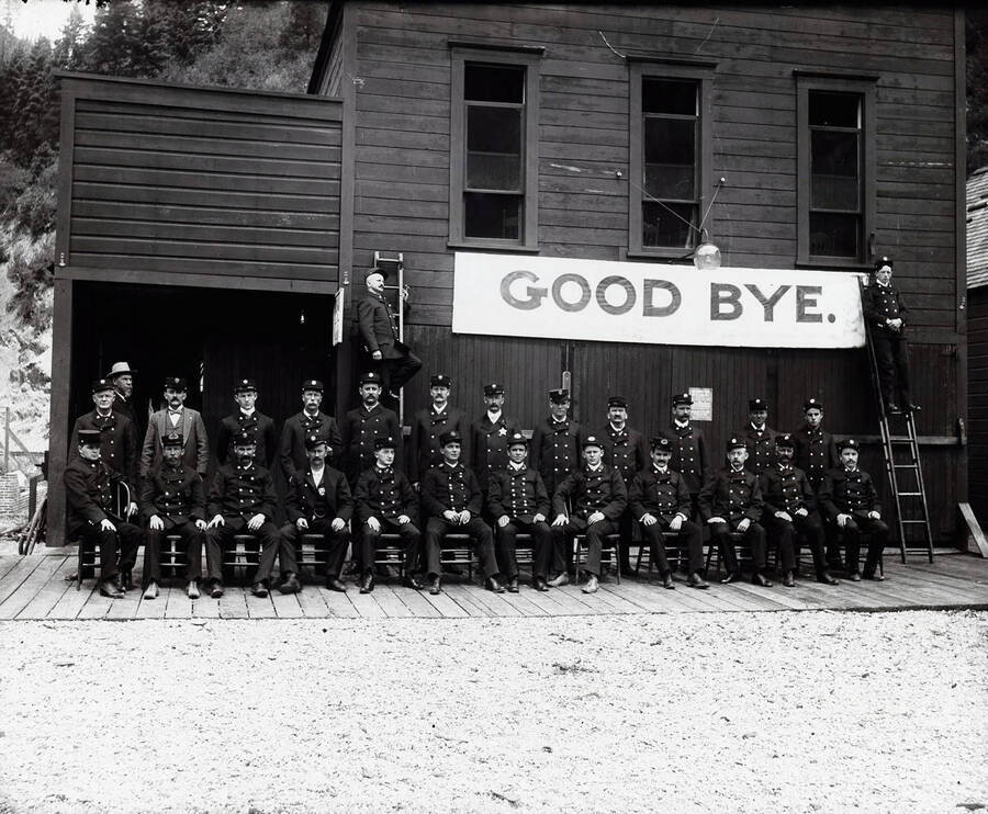 A group of firemen pose outside the old fire station in Wallace, Idaho.