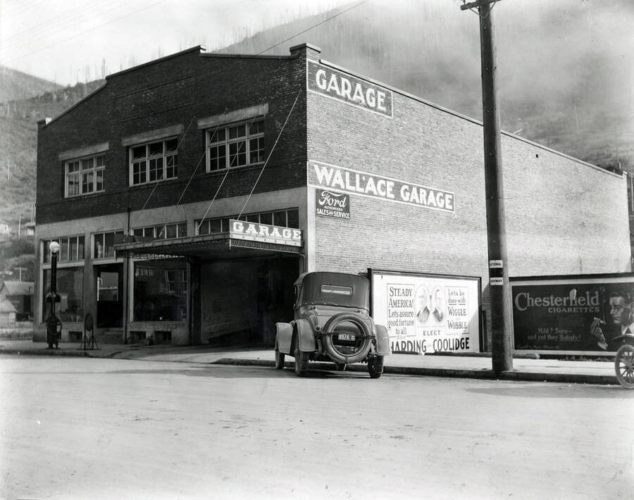 Exterior view of Wallace garage showing Ford sign.
