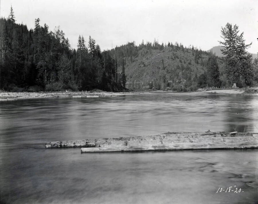 Image shows river and tree covered hills in the background. The image was taken at Linfor October 18, 1920 for T. Towles.