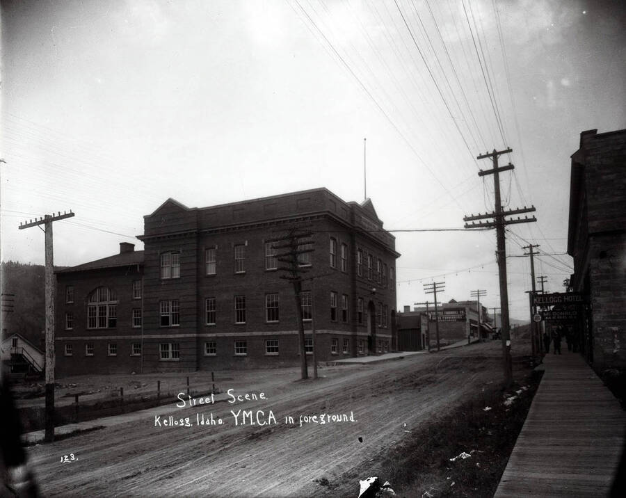A view of McKinley Avenue in Kellogg, Idaho; Caption on front: "Street scene YMCA in foreground"