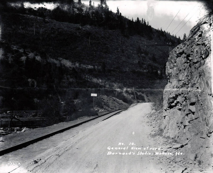 View. O.W.R. and N. (Oregon Washington Railroad and Navigation Company) tracks off Mullan Road, one of the first major engineered highways in the Pacific Northwest, runs through Shoshone County, Idaho, 1924, parallel to the current Interstate 90. H.E. Davis.