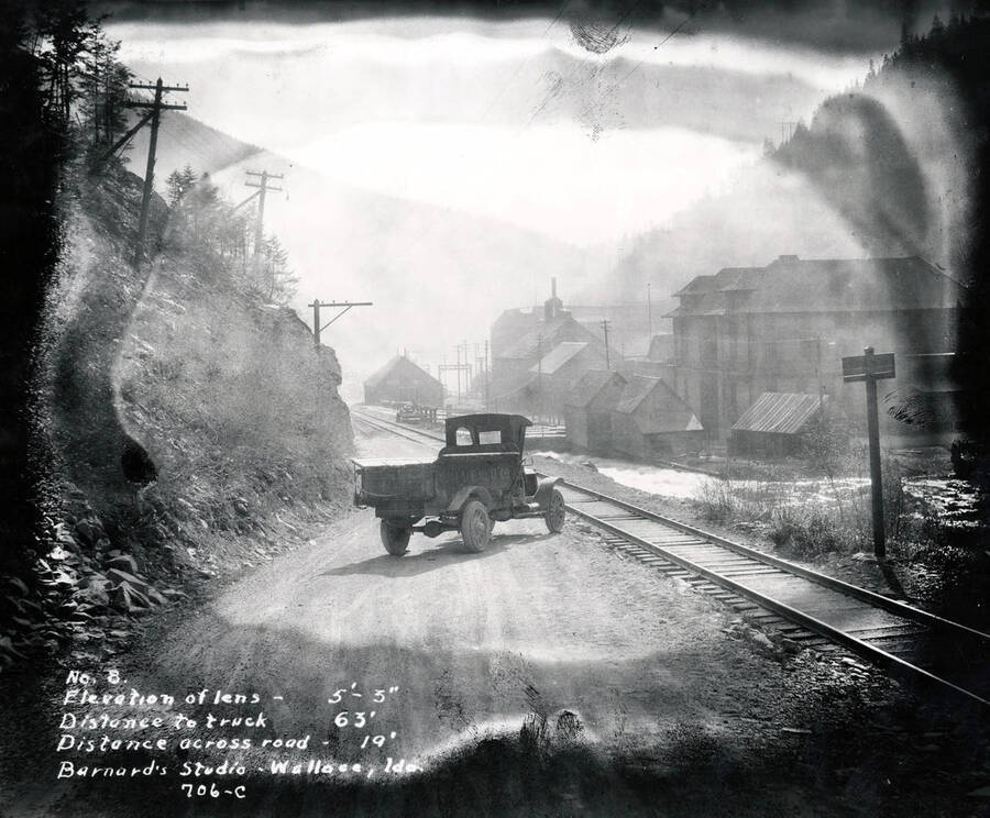 A meat truck on Mullan Road, one of the first major engineered highways in the Pacific Northwest that runs parallel to the current Interstate 90. Images shows a section of Mullan Road in Wallace, Idaho, 1924. H.E. Davis