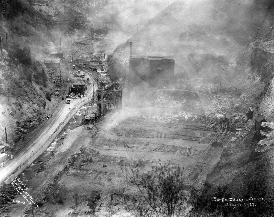 Images shows smoke rising from the smoldering ground in Burke after the fire July 13, 1923 which destroyed Hecla Mine.