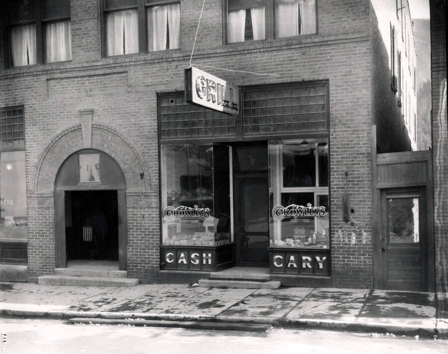 Exterior view of Crowley's Grocery, a Cash and Carry,  a part of the Morrow Retail Stores located on Bank Street in Wallace, Idaho, 1925.