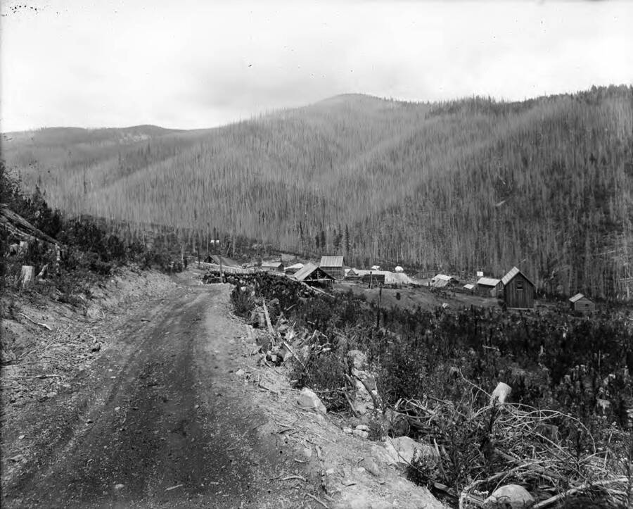 Panoramic view at distance of the mine and a dirt road leading to it