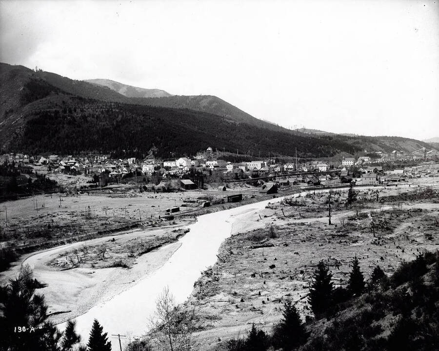 Town of Kellogg, Idaho. Image shows railroad tracks and South Fork of the Coeur d'Alene river.