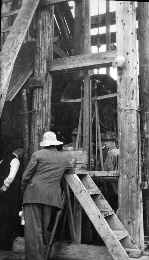 Interior of the mine with men standing around