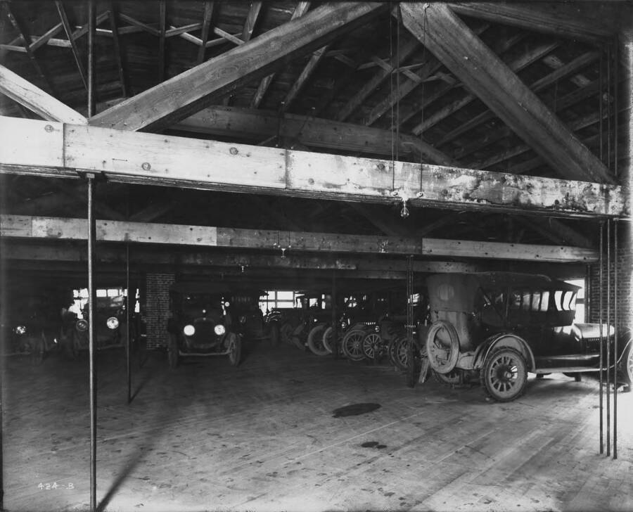Interior of Hendricks Garage shows automobiles of various makes and models (1916-1918 Dodge, Ford, Chevrolet).