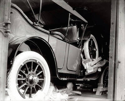 Image shows antique automobiles - in a railroad car [1914]. Taken for O.W.R. & N. Co. [Oregon-Washington Railroad and Navigation Company].