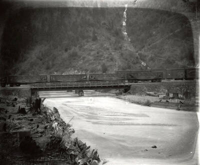 The railroad crossing over the Coeur d'Alene River in Idaho. Taken for H.L. Day.