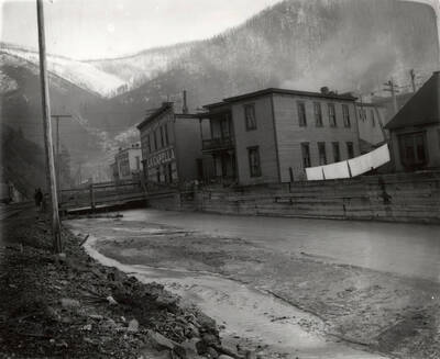 Gilmores Loan Office on the bank of the Coeur d'Alene River in Wallace, Idaho. Taken for H.L. Day.