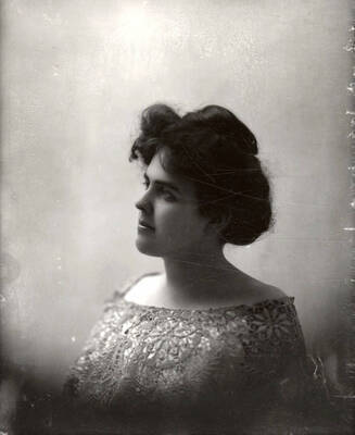 A bust profile of Dolly Dolittle Dollar.