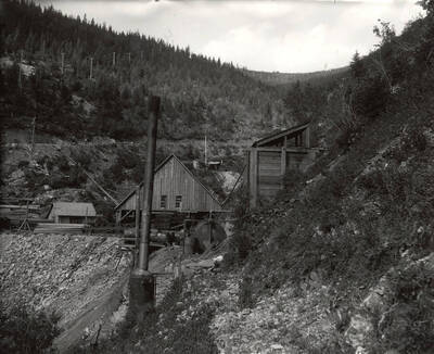 The Hercules Mining Company, with trees and buildings, in Burke, Idaho. Taken for Mr. Day for a lawsuit.
