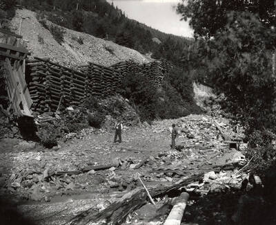 A few men standing on the Hercules Mining Company in Burke, Idaho. Taken for Mr. Day for a lawsuit.