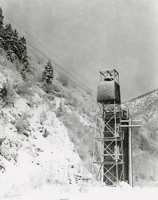The fire bell covered in snow. Located in Wallace, Idaho at the "Y" where Burke and Mullan highways intersect.