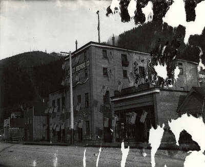 The Sunset Brewing Company building decorated with flags.