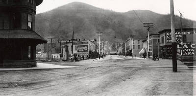 A street scene of buildings and people in Wallace, Idaho.