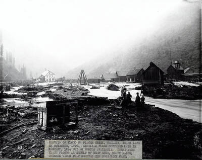 Image is of Wallace, Idaho after the flood of 1896. Caption on front: "Results of flood on placer creek, Wallace, Idaho late in November 1896. Similar flood occurred late in January, 1894 but no photos available. These were flash floods as result of deep snow, heavy rains, Chinook winds that removed the snow very fast."