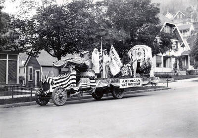 Men and women standing on the American War Mothers float for the Eagles parade in Wallace, Idaho.