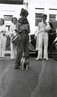 A child with a dog at the Veterans pet parade in Wallace, Idaho.