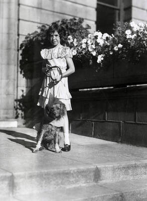A girl with her dogs at the Veterans pet parade in Wallace, Idaho.