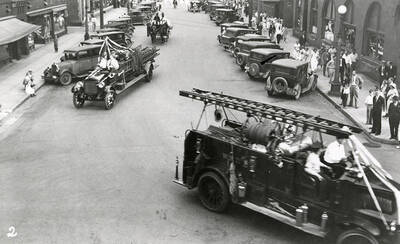 The fire engines driving during the Elks Roundup parade in Wallace, Idaho.