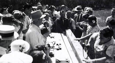 People hammering nails during the Coeur d'Alene hardware picnic at Pottsville.