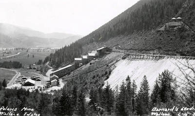 View of the buildings and mountains on the Polaris Mine in Wallace (i.e. Osburn), Idaho. The Polaris mill and change house can be seen.
