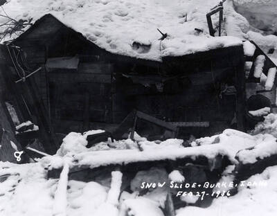 View of a building covered in snow during the snow slide in Burke, Idaho.