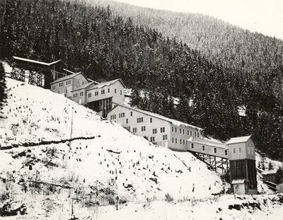 Exterior view of the Coeur d'Alene Mine mill during the winter, in Osburn, Idaho.