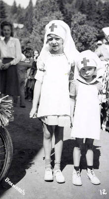 Two girls in costume for the Mullan 49'er parade in Mullan, Idaho.
