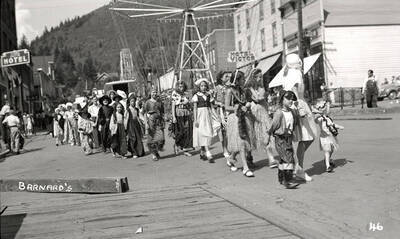 Children, who are in costume, walking in the Mullan 49'er parade in Mullan, Idaho.
