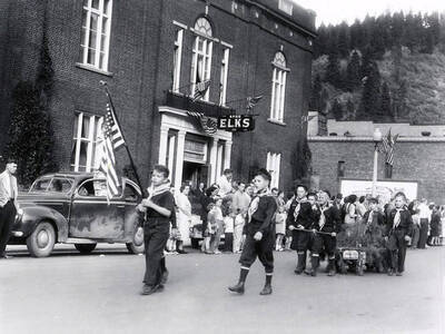 The Scouts and Campfire groups walking in the Children's parade during the Elks Roundup parade in Wallace, Idaho.