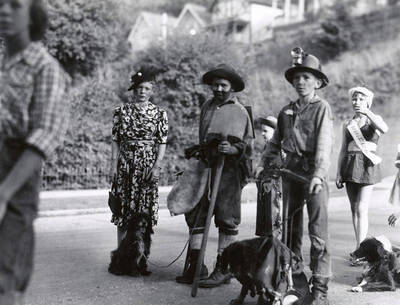 Children in costume with their pets during the Slippery Gulch parade in Wallace, Idaho.